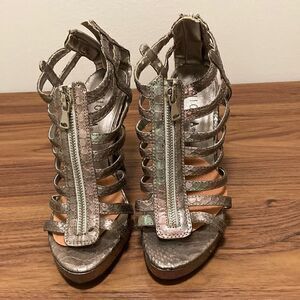 Enigma Bronze Gladiator High Heel Sandal with Zipper Accent on Vamp and Heel.